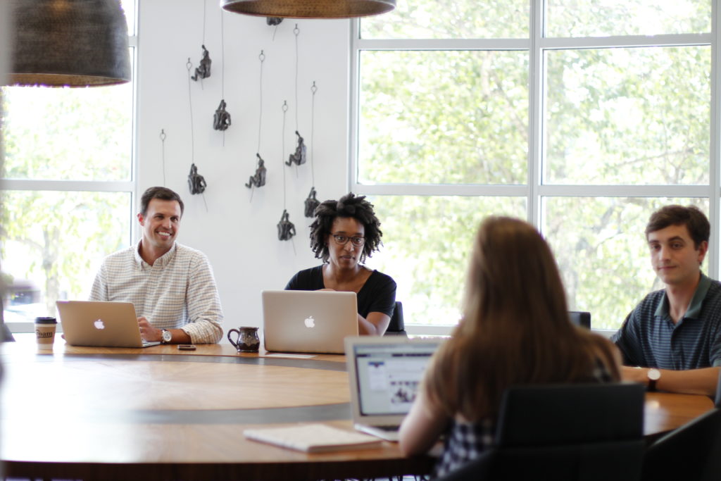 Members meeting in boardroom at Roam