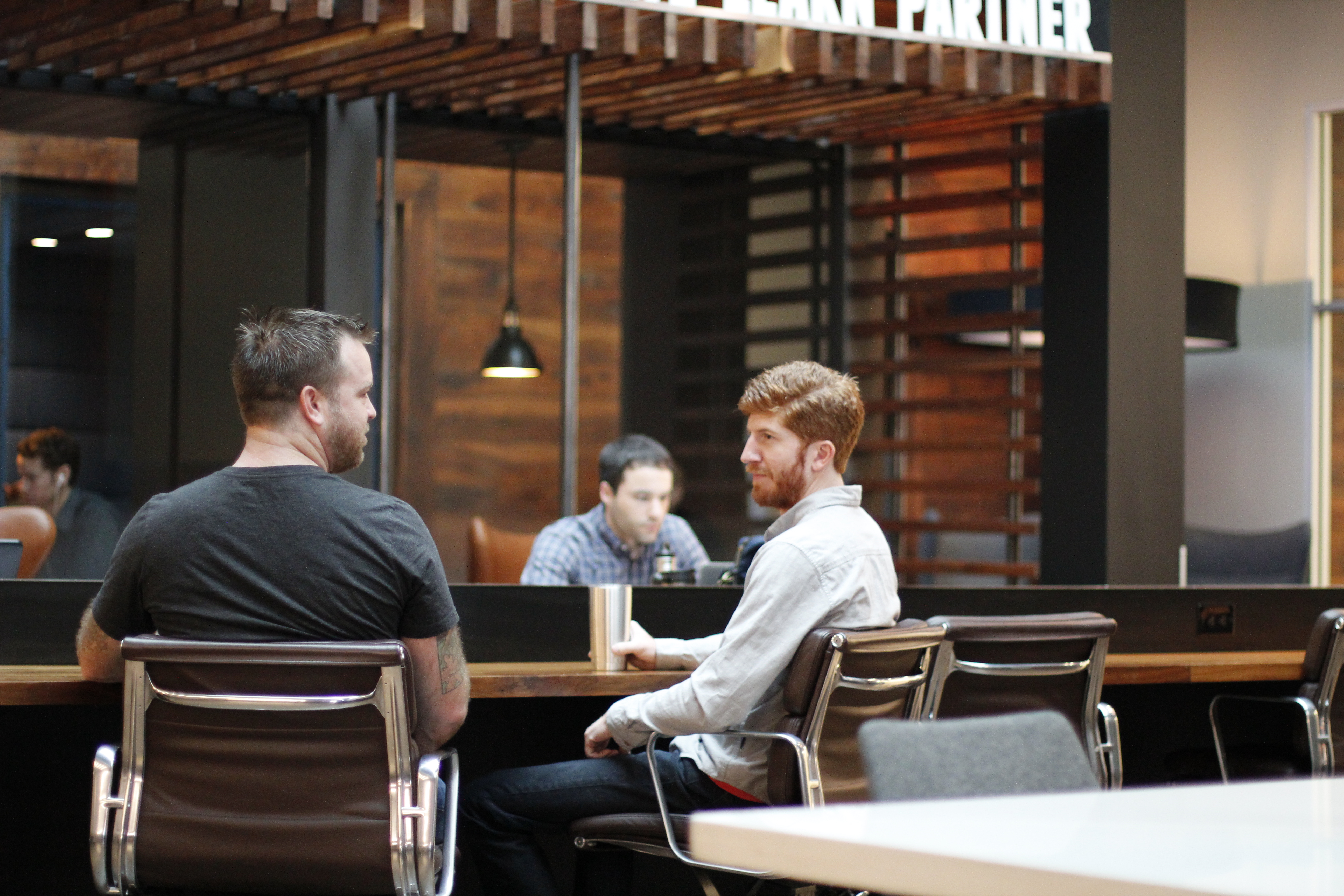 Men in coworking space at Roam Galleria