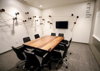 Meeting room seating 8 people at Roam Perimeter Center