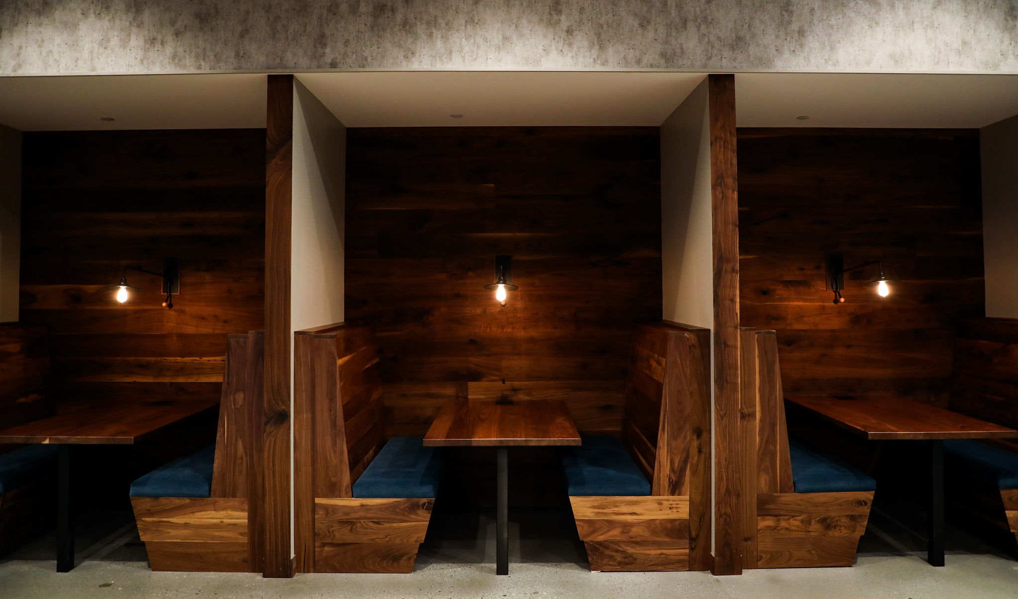 Booth seating in shared workspace at Roam Lenox