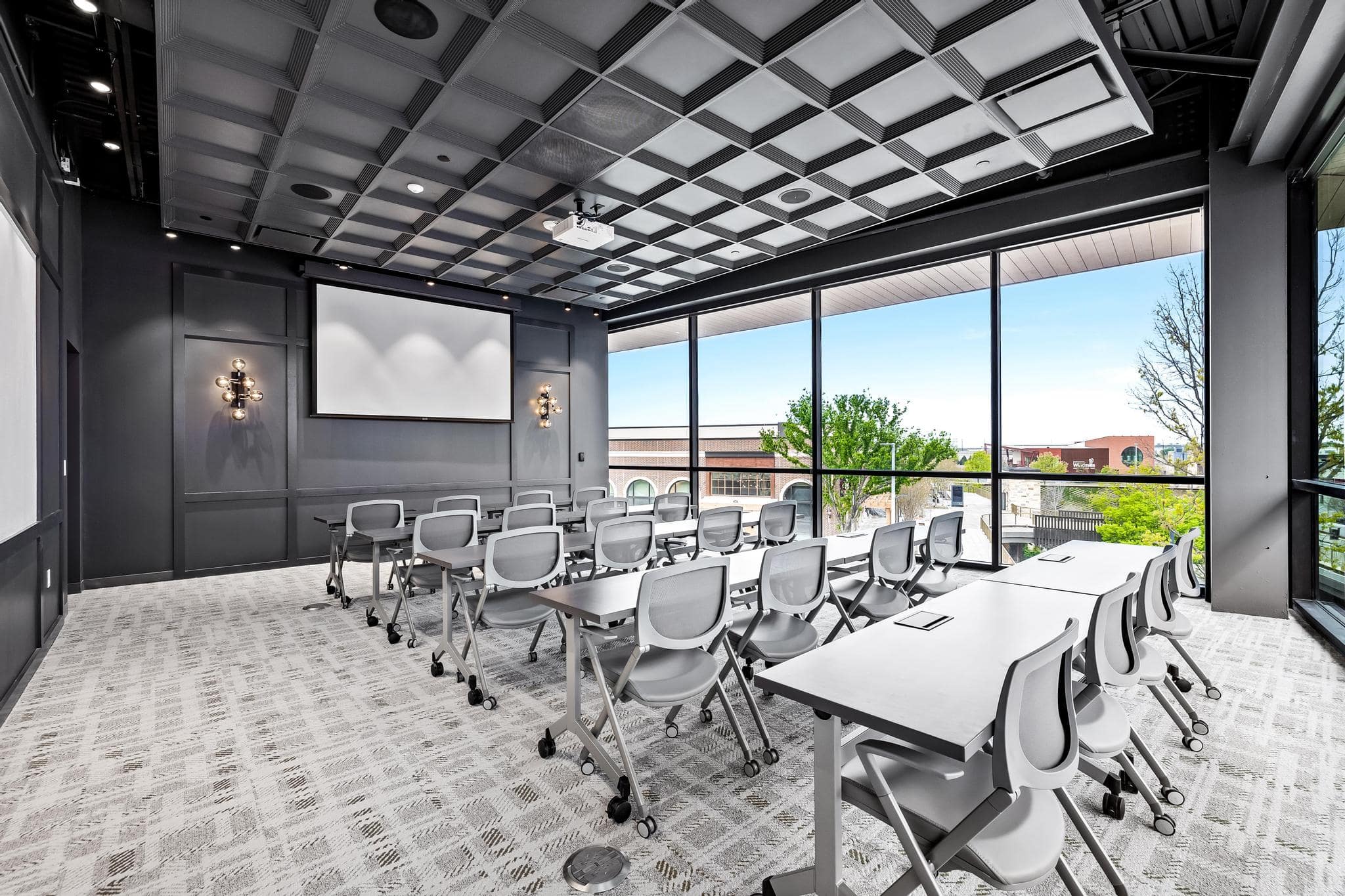Spacious meeting space featuring two walls of floor-to-ceiling windows