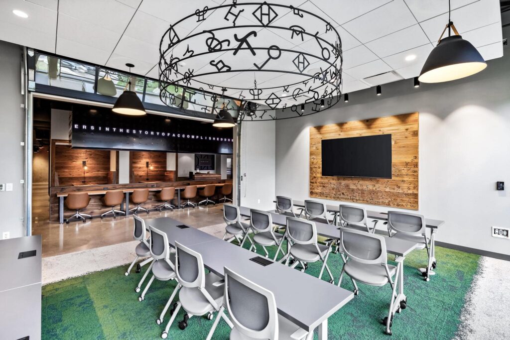 Luxury training room features garage doors for a unique meeting experience in North Dallas, Texas