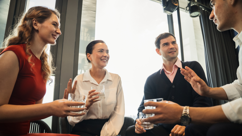 coworkers conversing at a happy hour