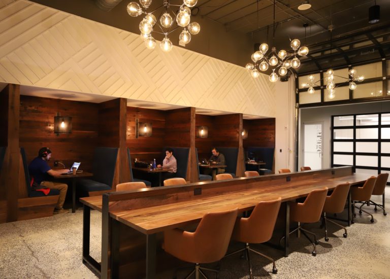 Meeting room with wooden table and booths