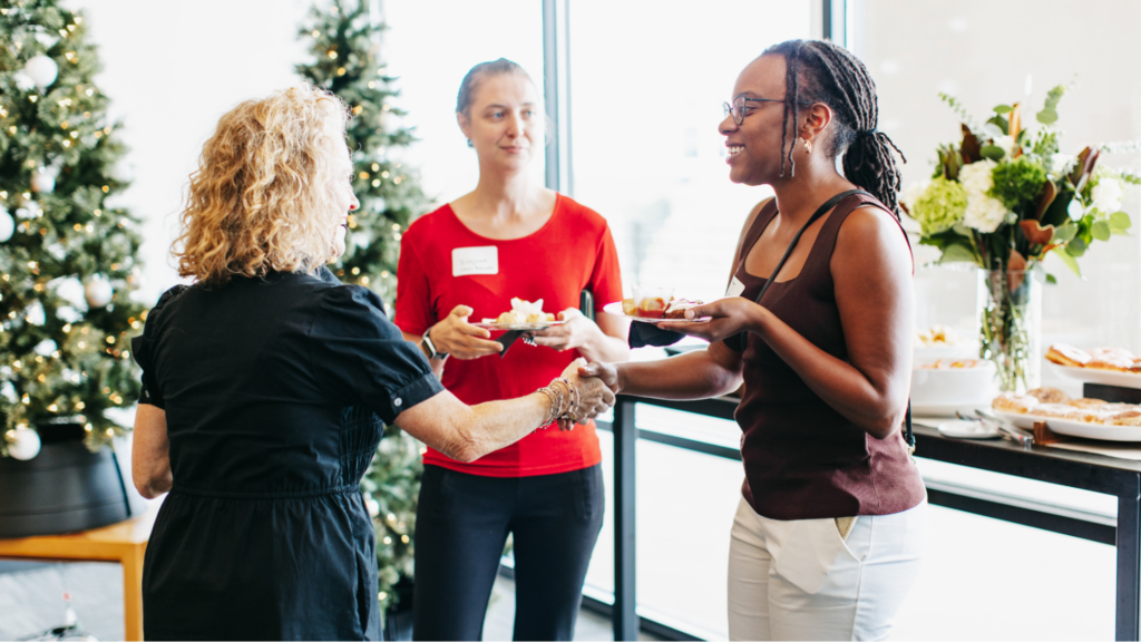 People talking at a corpoarate christmas/holiday party