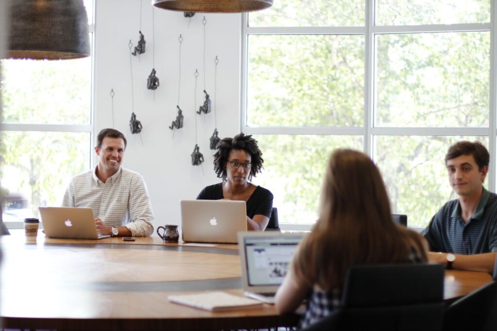 4 people meeting at a table