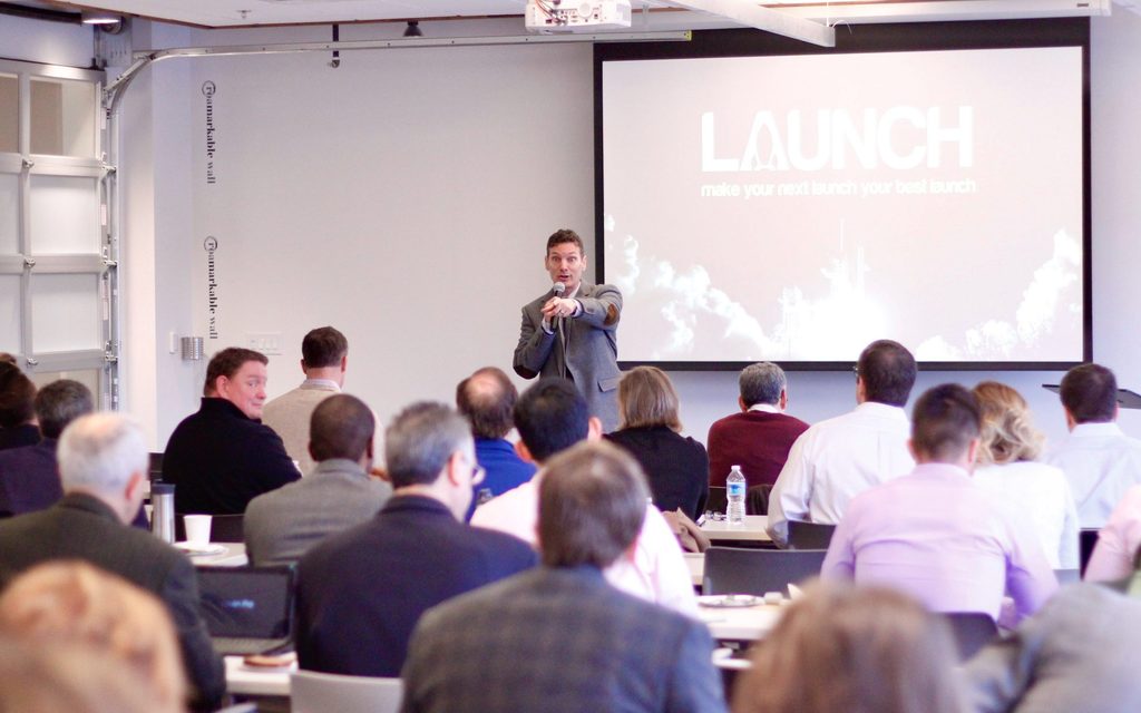 man giving a presentation in a Roam conference room 